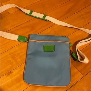 Blue coach crossbody bag with green accents